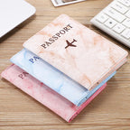étuis passeports marbre avion
